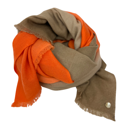 Two-toned orange and brown scarf on a white background